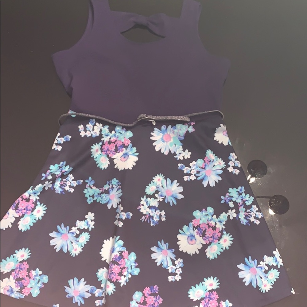 Navy blues dress with blue flower and sparkly belt